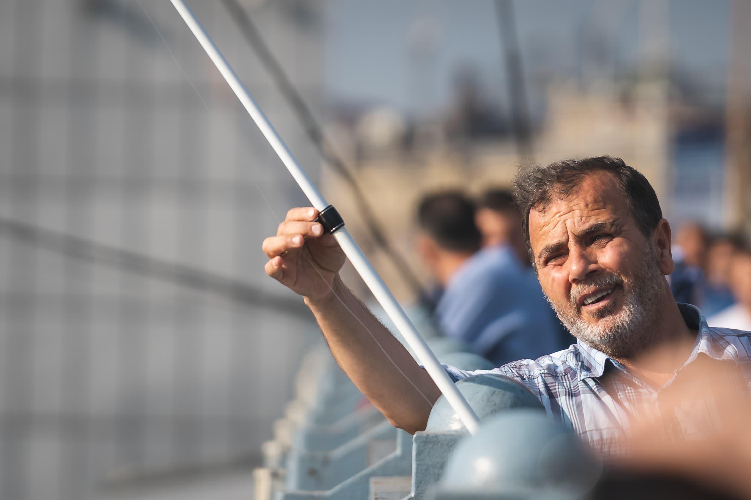 portrait of fisherman on galata bridge