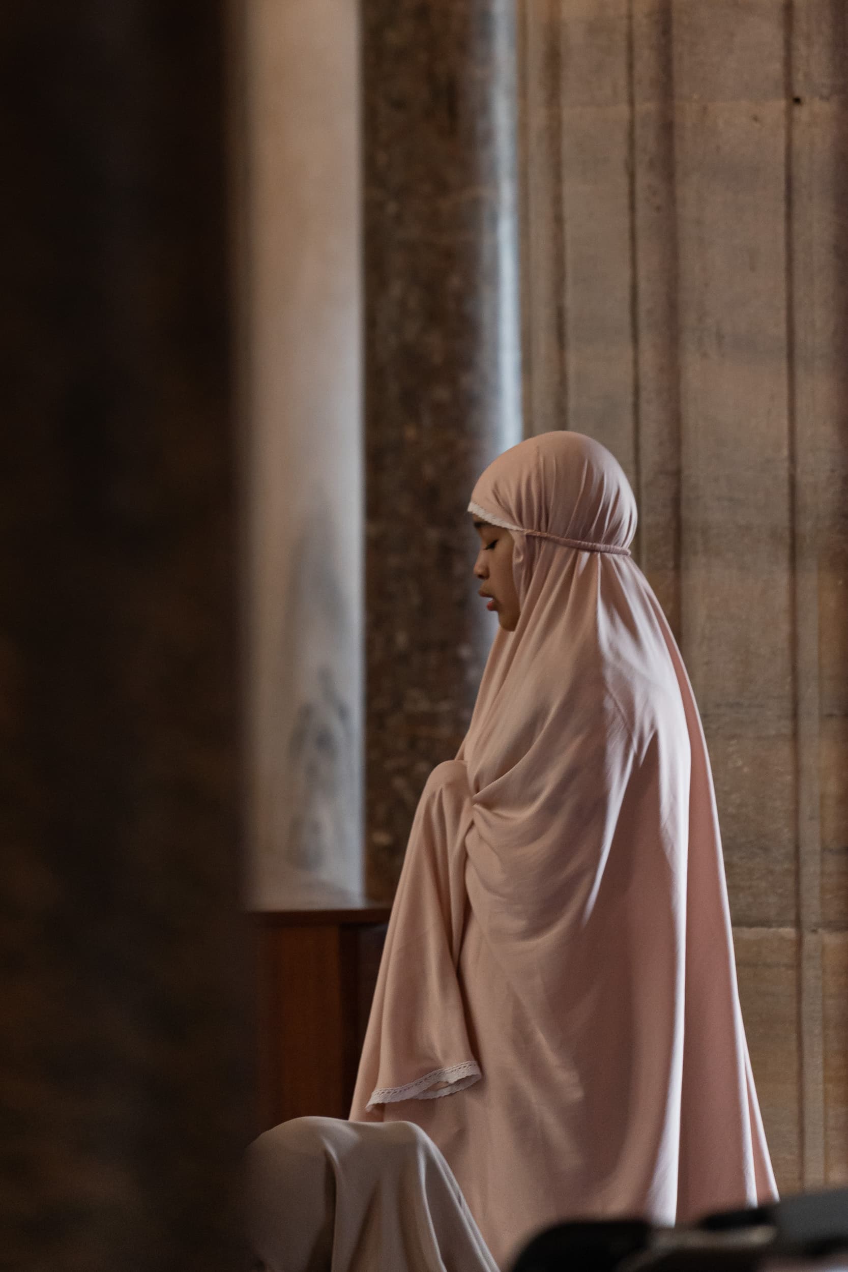 woman prayers blue mosque