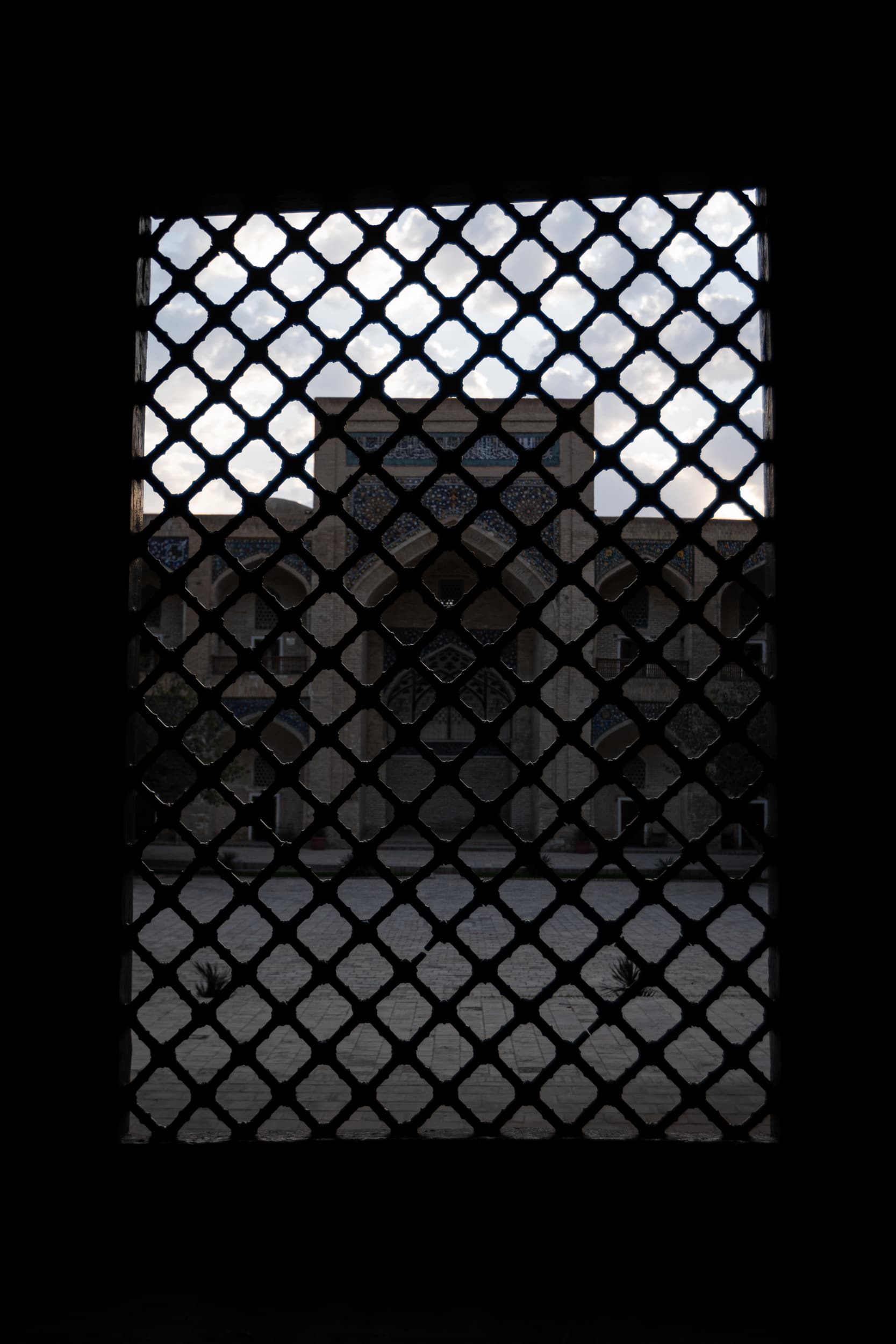 Bukhara Madrasa behind bars