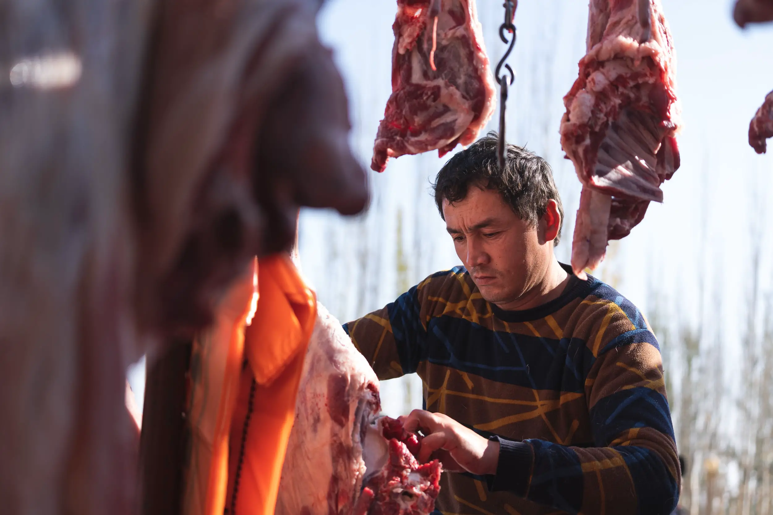 butcher at livestock market Kashgar
